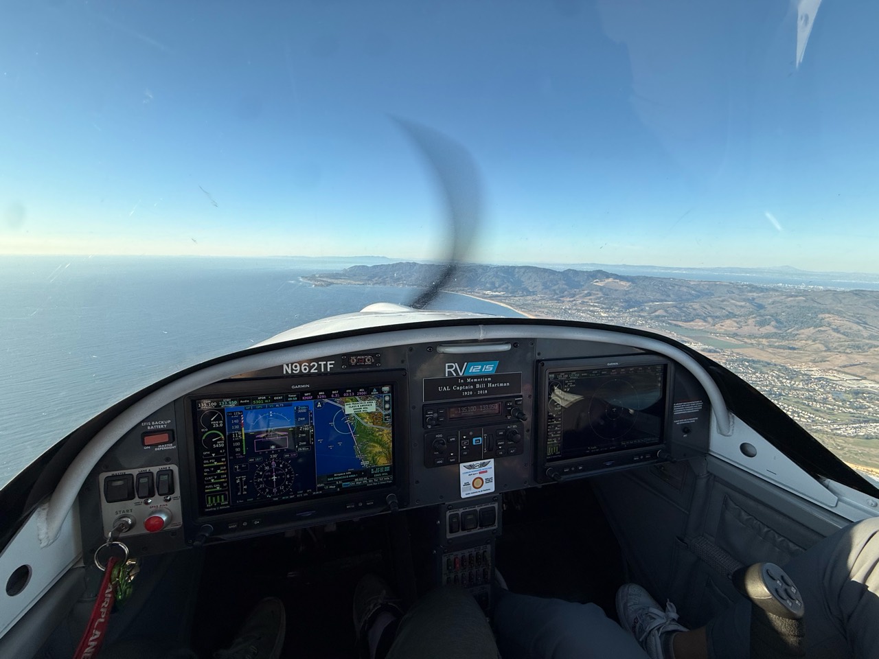 The RV-12iS instrument panel and a coastal view in flight