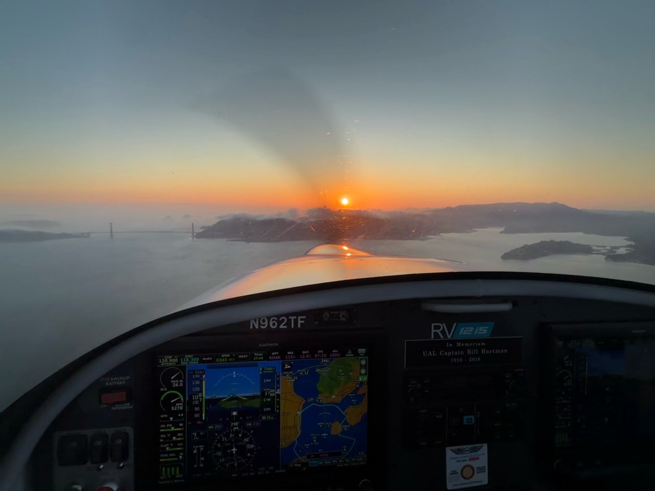 Sunset over the bay seen from the cockpit of N962TF
