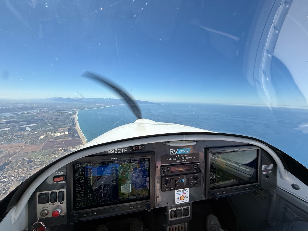 A sweeping coastline seen from the cockpit